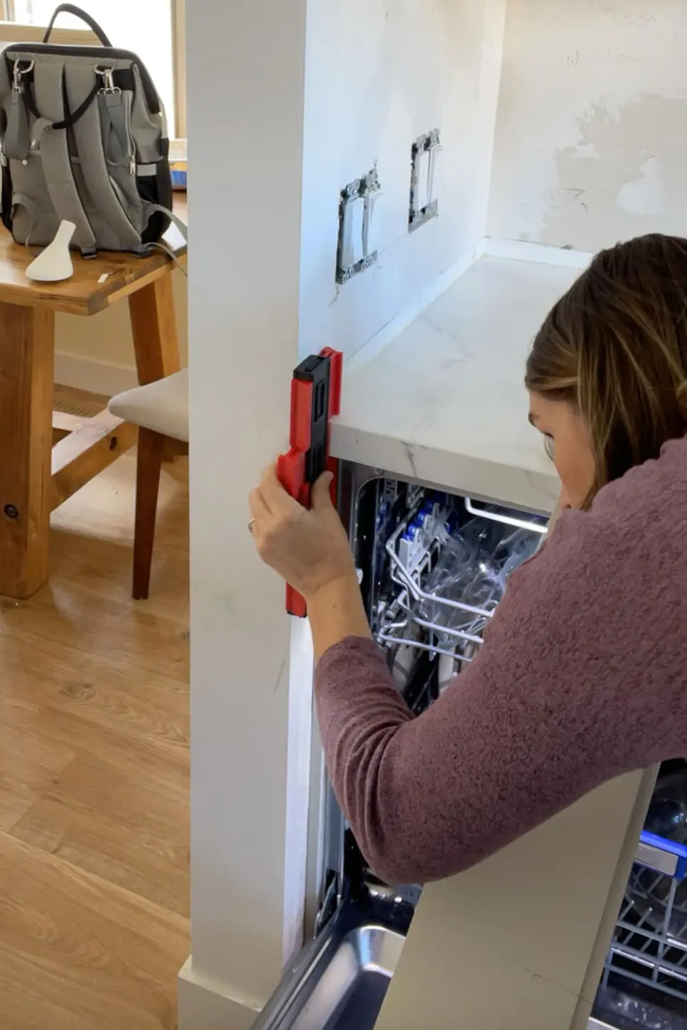 Using a contour gauge during kitchen remodel.